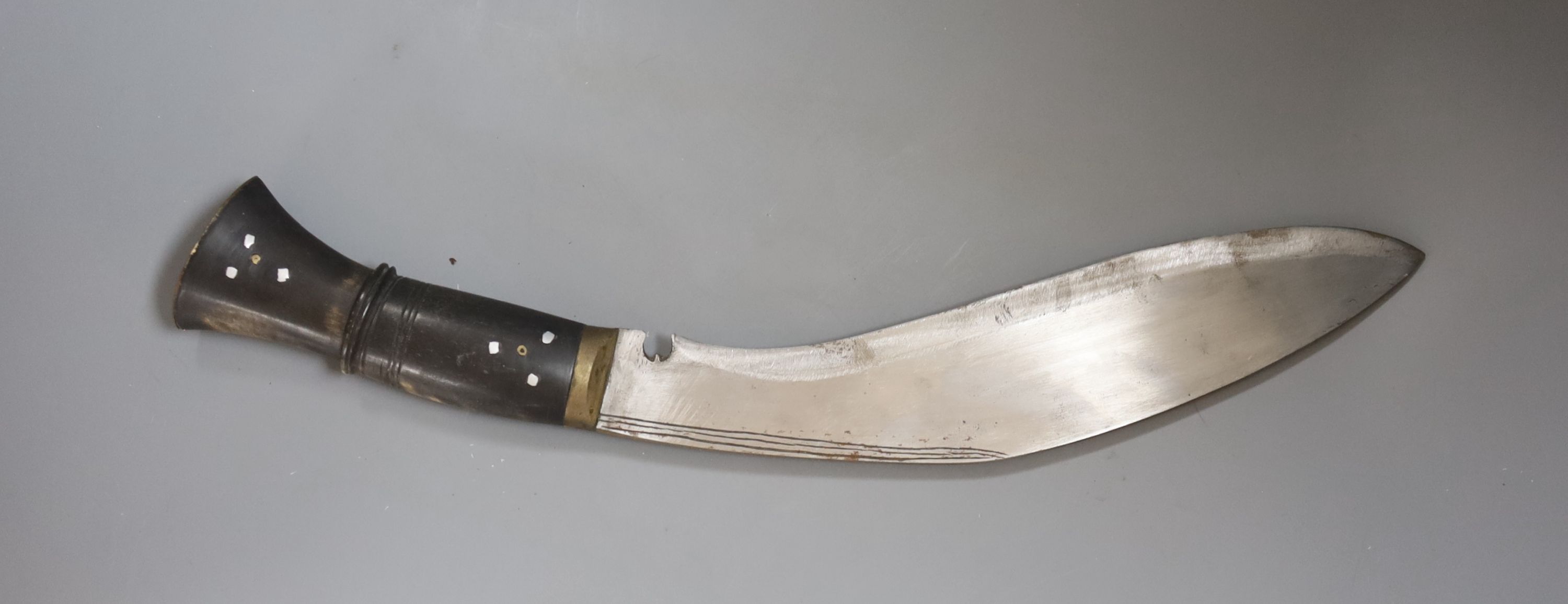 A Nepalese curved kukri with enamel inlaid sheath